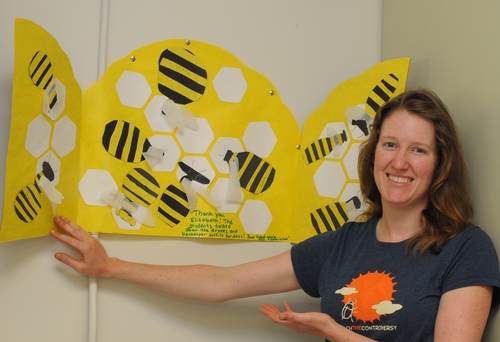 COLORFUL BEES, created by second graders at the Grace Valley Christian Academy, Davis, decorate the inside of the thank-you card, given to Elizabeth Frost (shown), staff research associate at the Harry H. Laidlaw Jr. Honey Bee Research Facility, UC Davis. (Photo by Kathy Keatley Garvey)