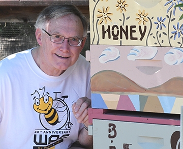 Honey bee guru Eric Mussen is serving his sixth term as WAS president. He is one of the three co-founders of WAS. The conference t-shirt is the work of UC Davis artist Steve Dana. (Photo by Kathy Keatley Garvey)