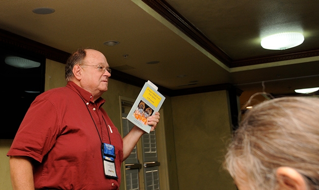 Beekeeper, book author and columnist Larry Connor addresses a crowd at the Western Apicultural Society meeting in 2010 in Healdsburg. (Photo by Kathy Keatley Garvey)