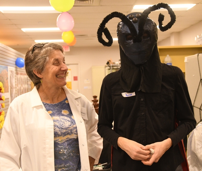 Lynn Kimsey, director of the Bohart Museum of Entomology and professor of entomology at UC Davis, delighted in student Parras McGrath's costume--a tarantula hawk. (Photo by Kathy Keatley Garvey)