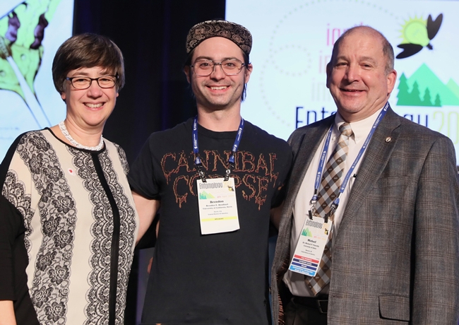 Brendon Boudinot (center) is the recipient of a first-place President's Prize for the second consecutive year in the Entomological Society of America's annual graduate student competition. With him are outgoing ESA president Susan Weller,  director of the University of Nebraska State Museum; and incoming ESA president Michael Parrella,  dean of the College of Agricultural and Life Sciences, University of Idaho, and former professor/chair of the UC Davis Department. (ESA Photo)