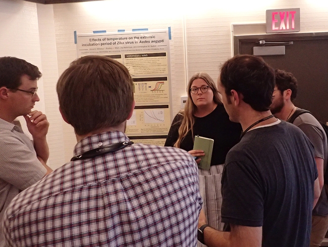 Olivia Winokur answers questions about her poster at the UC Davis Research Symposium on the Designated Emphasis in the Biology of Vector-Borne Diseases (DEBVPD). (Photo by Kathy Keatley Garvey)