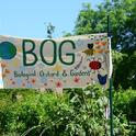 The Biological Orchard and Gardens (BOG) sign features floral and insect designs. It's located by the Mann Laboratory, UC Davis campus. (Photo by Kathy Keatley Garvey)