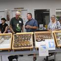 Retired entomologist and UC Davis alumnus Norm Smith (second from left) talks to visitors at the Bohart Museum of Entomology's 