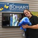 UC Davis student and Bohart associate Emma Cluff holds a plush water bear from the Bohart Museum's gift shop. It costs about $30, plus tax, will all proceeds to finance educational programs at the Bohart. (Photo by Kathy Keatley Garvey)