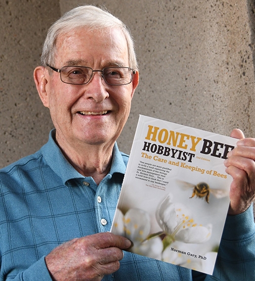 Retired apiculturist Norm Gary and his newly published second edition. (Photo by Kathy Keatley Garvey)