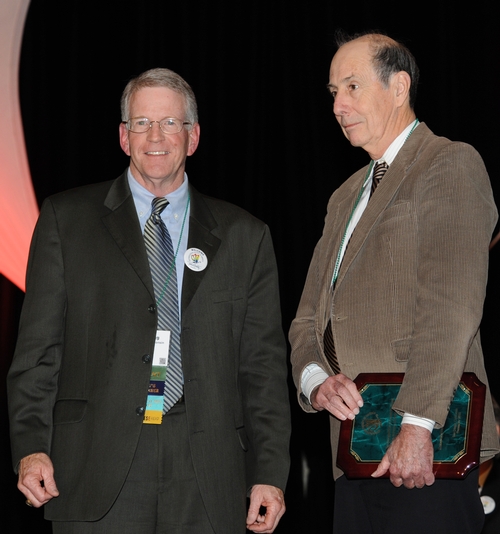 NEWLY INDUCTED FELLOW Bruce Hammock (right), distinguished professor of entomology at the University of California, Davis, with ESA president Dave Hogg of the University of Wisconsin. (Photo by Kathy Keatley Garvey)