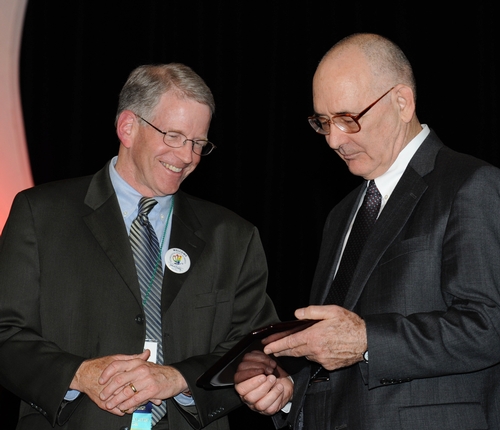 THOMAS MILLER (right) of the University of California, Riverside receives congratulations from Dave Hogg, president of ESA.  Miller was one of 10 Fellows honored at the ESA ceremony in San Diego. (Photo by Kathy Keatley Garvey)