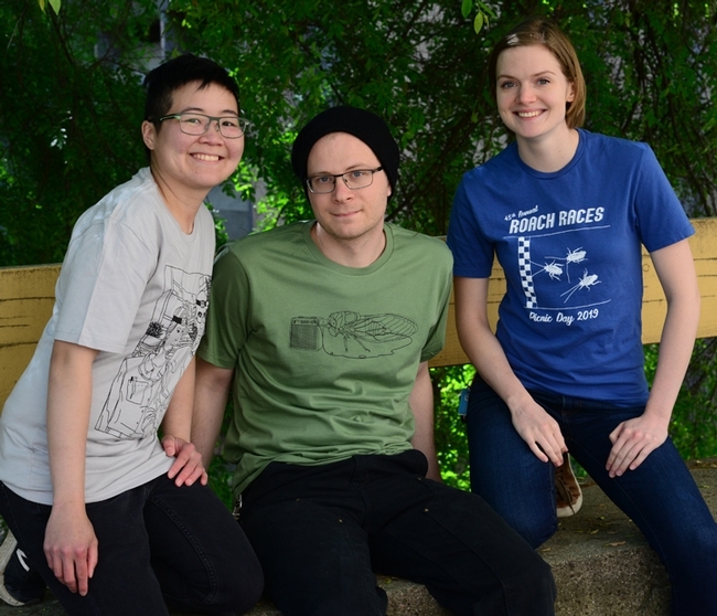 These are the new t-shirts to be offered by the Entomology Graduate Student Association on UC Davis Picnic Day. From left are artists/scientists Ivana Li, Corwin Parker and Jill Oberski. (Photo by Kathy Keatley Garvey)