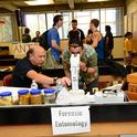 Forensic entomologist Robert Kimsey (left) held forth at the forensic entomology table in Briggs Hall during the 2019 UC Davis Picnic Day. He recently won a College of Agricultural and Environmental Sciences' advising award. (Photo by Kathy Keatley Garvey)