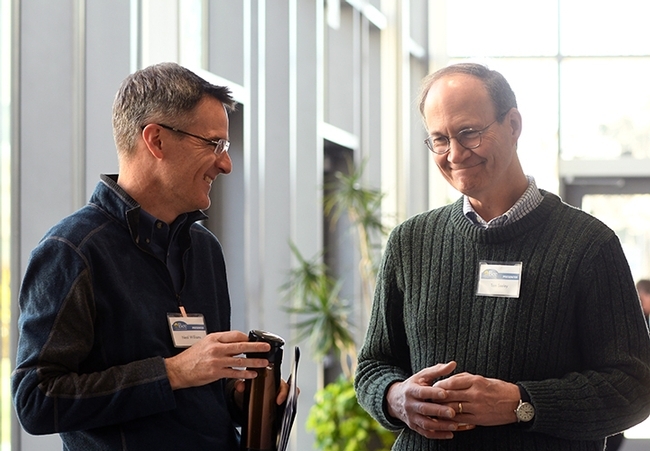 Professor Tom Seeley (right) of Cornell University chats with UC Davis Professor Neal Williams following Seeley's keynote address to the 2018 UC Davis Bee Symposium. (Photo by Kathy Keatley Garvey)