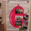 This is researcher Christophe Morisseau's water balloon battle poster, now on display in the Briggs Hall basement, outside his office. (Photo by Kathy Keatley Garvey)
