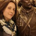 Rebecca Godwin with a statue of Theodore Roosevelt at the American Museum of Natural History, where she did some of her research. She won first place in the student poster research competiion at the recent meeting of the American Arachnological Society.