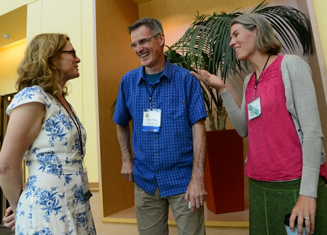 International Pollinator Conference co-chair Neal Williams shares a laugh with keynote speaker Lynn Dicks (left) of the University of East Anglia, UK, and speaker Rachel Vannette of the UC Davis Department of Entomology and Nematology. (Photo by Kathy Keatley Garvey)