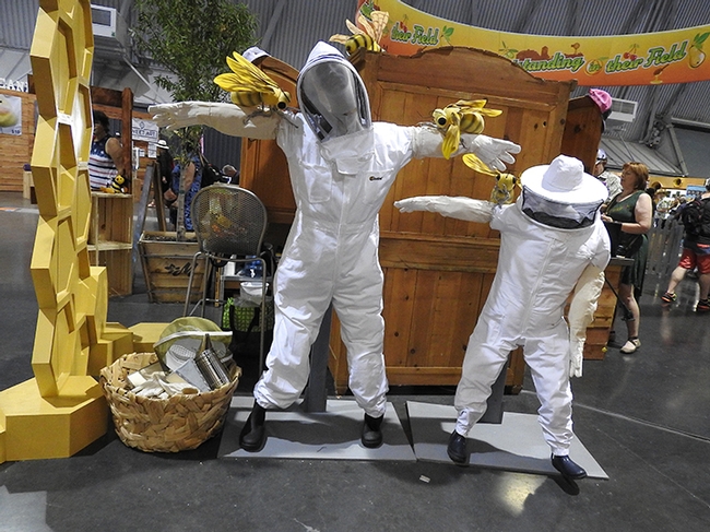Beekeeper mannequins greet visitors in Building B of the California State Fair. (Photo by Kathy Keatley Garvey)