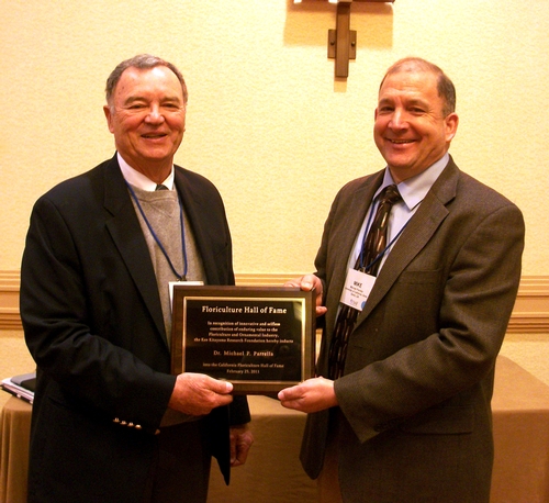 HALL OF FAME--Michael Parrella (right), professor and chair of the UC Davis Department of Entomology, was inducted into the California Floriculture Hall of Fame on Feb. 25 in San Diego. With him is presenter Mike Mellano Sr., of Mellano & Company, Oceanside. Mellano was inducted into the Floriculture Hall of Fame in 1990. (Photo Courtesy of Debi Aker)
