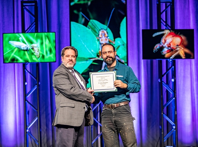 UC Davis doctoral candidate Brendon Boudinot, winner of the John Henry Comstock Award from the Pacific Branch of ESA, and ESA President Robert Peterson of Montana State University pose for a photo. (ESA Photo)
