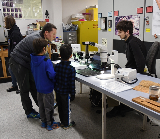 Doctoral student Zachary Griebenow greets visitors eager to learn about ants. (Photo by Kathy Keatley Garvey)