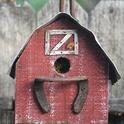 Find the ootheca! It's on this barn-themed birdhouse. (Photo by Kathy Keatley Garvey)