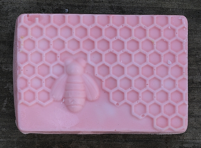 A honey bee motif on a hand-made bar of soap, the work of Teresa Hickman. (Photo by Kathy Keatley Garvey)