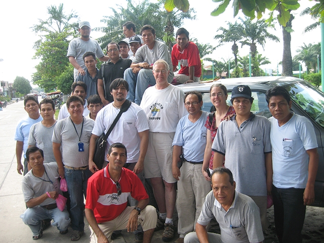 UC Davis medical entomologist Thomas Scott (center) and his field site director Amy Morrison with their mosquito collector and data management teams in Iquitos, Peru. (Photo courtesy of Thomas Scott lab)