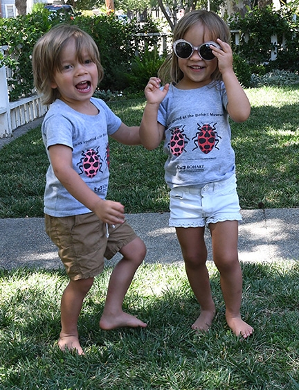 Cute as bugs in a rug. Twins Eli and Penny, pictured at age 3, wearing their ladybug t-shirts (Photo by Kathy Keatley Garvey)