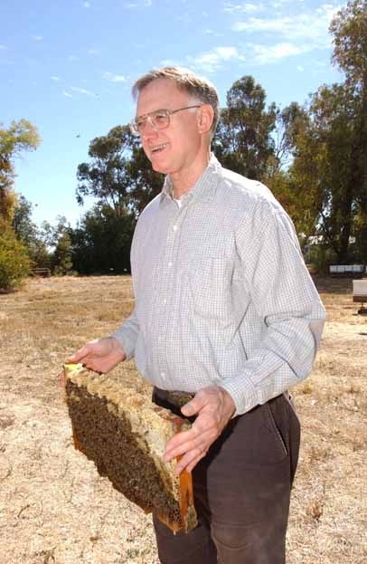 Eric Mussen holding a frame at the Harry H. Laidlaw Jr. Honey Bee Research Facility. (Photo by Kathy Keatley Garvey)