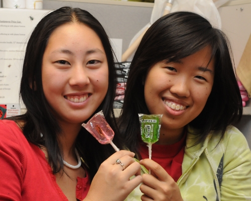 Nanase Nakanishi (left) and Grace Wong, UC Davis students and employees at the Bohart Museum of Entomology, display the Cricket Lick-Its available at the Bohart Museum. Nanase, majoring in animal science, moved to Davis from New Jersey. Grace, majoring in environmental science, is from Benicia. (Photo by Kathy Keatley Garvey)