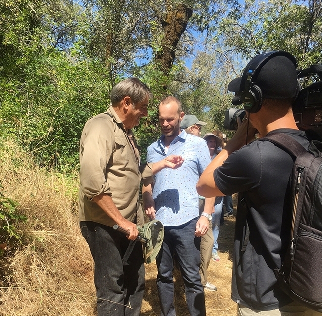 Greg Karefelas (left), an associate at the Bohart Museum of Entomology, shares his expertise of the California dogface butterfly with Rob Stewart of the TV program, 