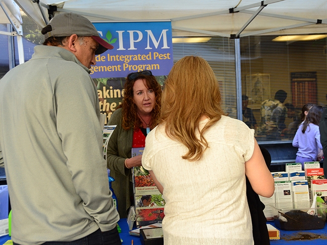 Karey Windbiel-Rojas, associate director for Urban and Community IPM and area Urban IPM advisor, answers a question at the 2019 UC Davis Picnic Day. (Photo by Kathy Keatley Garvey)