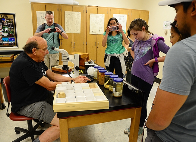 Visitors at the 2019 UC Davis Picnic Day take images of forensic entomologist Robert Kimsey of the UC Davis Department of Entomology and Nematology and his display. (Photo by Kathy Keatley Garvey)