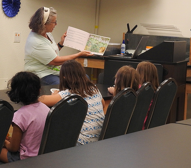 Professor Fran Keller of Folsom Lake College reads her children’s book, “The Story of the Dogface Butterfly,” available in the gift Shop. (Photo by Kathy Keatley Garvey)