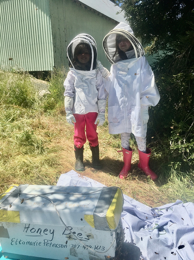 Beekeepers and sisters, Sofia (left) and  Annabelle are enrolled in Ettamarie Peterson's Liberty 4-H Club beekeeping project in Petaluma. Sofia is a second-year beekeeper, and Annabelle, a third-year. (Photo by Ettamarie Peterson)