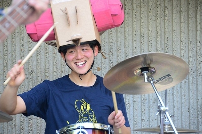 Yao Cai dressed as a fruit fly to play the drums in The Entomology Band at the 2018 UC Davis Picnic Day. (Photo by Kathy Keatley Garvey)