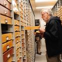 Entomologist and butterfly collector Bill Patterson looks through a drawer during the international Lepidopterists' Society meeting in 2017 at UC Davis. (Photo by Kathy Keatley Garvey)