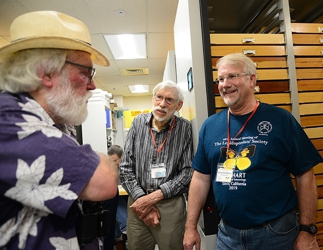 Entomologist Bill Patterson (center) of Sacramento and the international Lepidopterists' Society president Brian Scholtens (right), entomology professor at the College of Charleston, South Carolina, discuss butterflies with scientist-author Robert Michael Pyle, founder of the Xerces Society for Invertebrate Conservation. UC Davis hosted the 2017 meeting of the Lepidopterists. (Photo by Kathy Keatley Garvey)