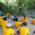 UC Davis student Christofer Brown presents a program on dragonflies  to middle schoolers enrolled in  the UC Davis Bio Boot Camp, held in the summer of 2022. This image was taken by Putah Creek. (Tabatha Yang Photo)
