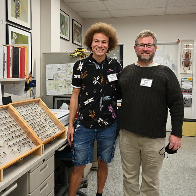 Christofer Brothers (left), a UC Davis doctoral student studying dragonflies, and Christopher Beatty, a visiting visiting scholar in the Program for Conservation Genomics at Stanford University, offered their expertise at the Bohart Museum open house. (Photo by Kathy Keatley Garvey)