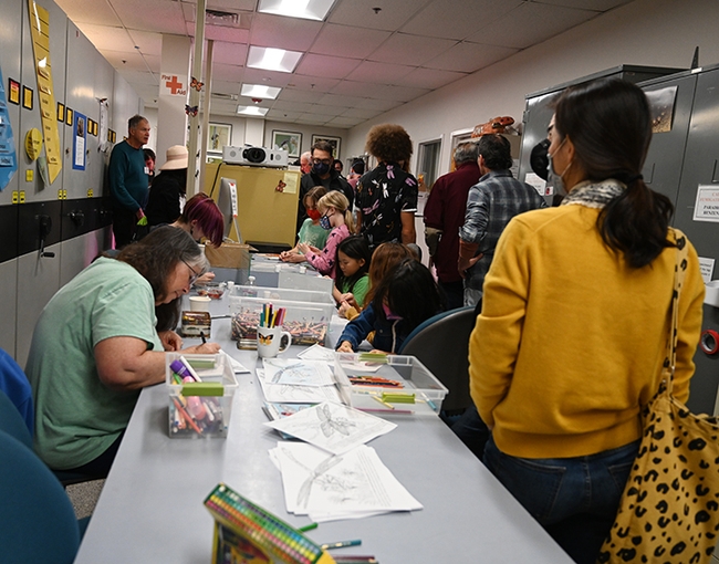 The arts-and-crafts activity at the Bohart Museum's dragonfly open house was a popular site. In the back (at left) is noted dragonfly expert Rosser Garrison of Sacramento. (Photo by Kathy Keatley Garvey)