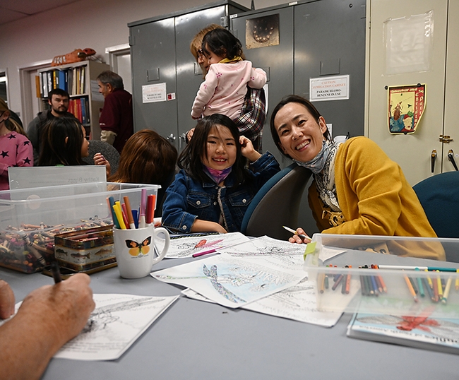 Sacramento residents Kay Lu of Sacramento and her daughter, Lena 7, loved creating the projects. (Photo by Kathy Keatley Garvey)