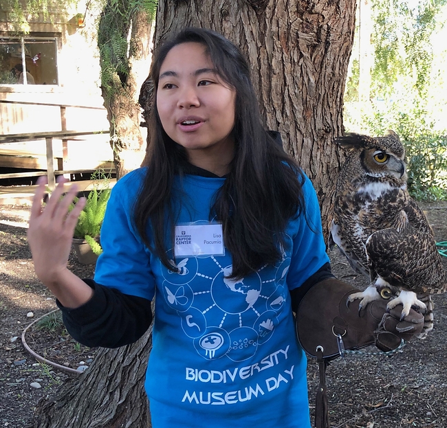 Lisa Pacumio of the Raptor Center answers questions about a great-horned owl. (Photo by Kathy Keatley Garvey)