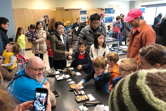 The crowd engages with scientists and checks out the displays at the paleontology collection, UC Davis Biodiversity Museum Day. (Photo by Kathy Keatley Garvey)