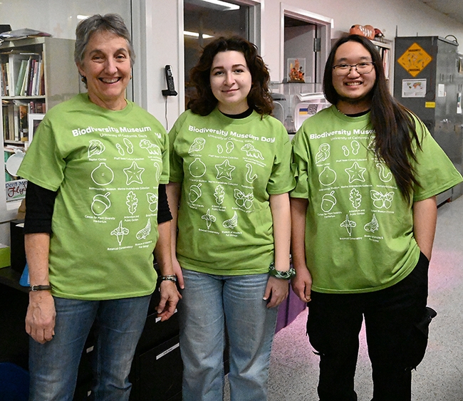 Wearing of the Green--Ready to greet the crowd at the Bohart Museum of Entomology on Feb. 18 are (from left) Lynn Kimsey, director of the Bohart Museum of Entomology and a UC Davis distinguished professor of entomology, and entomology students and Bohart associates, Sol Wantz, president of the Entomology Club,  and Allen Chew. (Photo by Kathy Keatley Garvey)