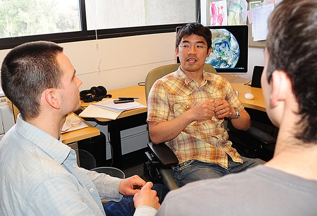 Professor Louie Yang chats with students in this archived image taken in his office. (Photo by Kathy Keatley Garvey)