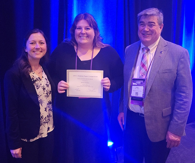 Congratulating Olivia Winokur (center), recipient of the Hollandsworth Prize for best student presentation at the American Mosquito Control Association (AMCA) annual conference are Casey Crockett (left), AMCA Student Competition coordinator, and Dennis Wallette, 2022-2023 AMCA president.