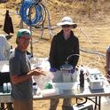 UC Santa Cruz Hydrogeology team members collect fluid samples during experiments at a managed aquifer recharge site. From left to right: Professor Andrew Fisher, graduate students Galen Gorski and Sarah Beganskas, and undergraduate student Dominique van den Dries. Photo courtesy of UCSC Hydrogeology and The Recharge Initiative.