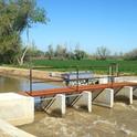 Flood waters are being diverted into canals to recharge groundwater using new, computer-operated gates. Photo by R. Long.