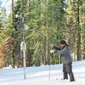 Dr. Safeeq measures snow depth at the Kings River Experimental Watersheds site in the Southern Sierra Nevada. Photo by Michelle Gilmore.