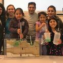 Dr. Sam Sandoval (center) shows afterschool program youth a groundwater model. Photo by Jose Huerta.