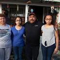 When Kristine Diekman spoke with the Garcia family, pictured in front of their home, they had been living without water in their well for almost two years. Photo by Kristine Diekman.